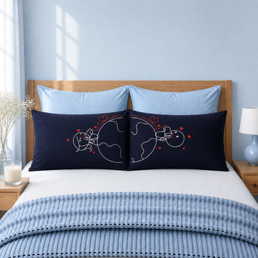 Dark blue couple pillowcases with red heart line art and split couple design