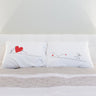 Unique wedding gifts for couples featuring his and hers pillowcases with romantic illustrations and heart designs