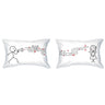 White pillowcases with line-art couple and red heart music notes design with small text